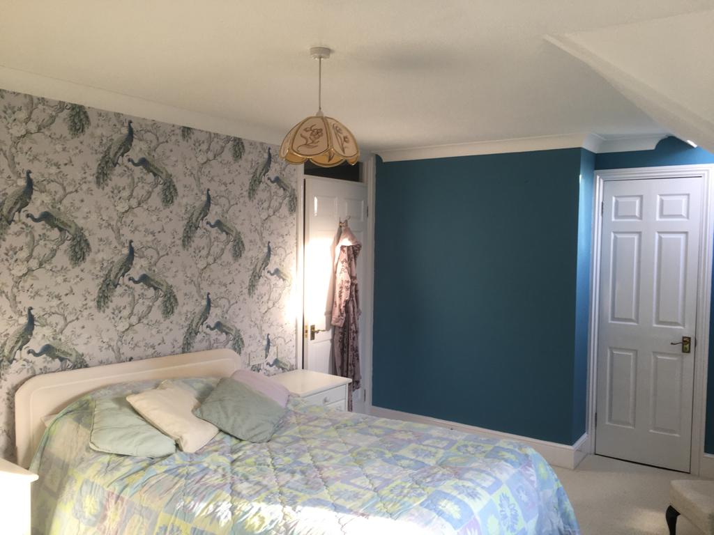 bedroom with blue wall